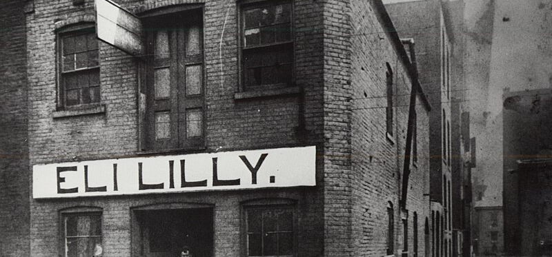 Geschäft von Eli Lilly im Jahr 1885 in Indianapolis (USA), aus dem ein global operierender Pharma-Riese wurde, der sich regelmäßig nationalen wie auch ausländischen GMP-Inspektionen unterziehen muss.